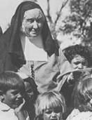 Sr. Katherine Clutterbuck photographed surrounded by children