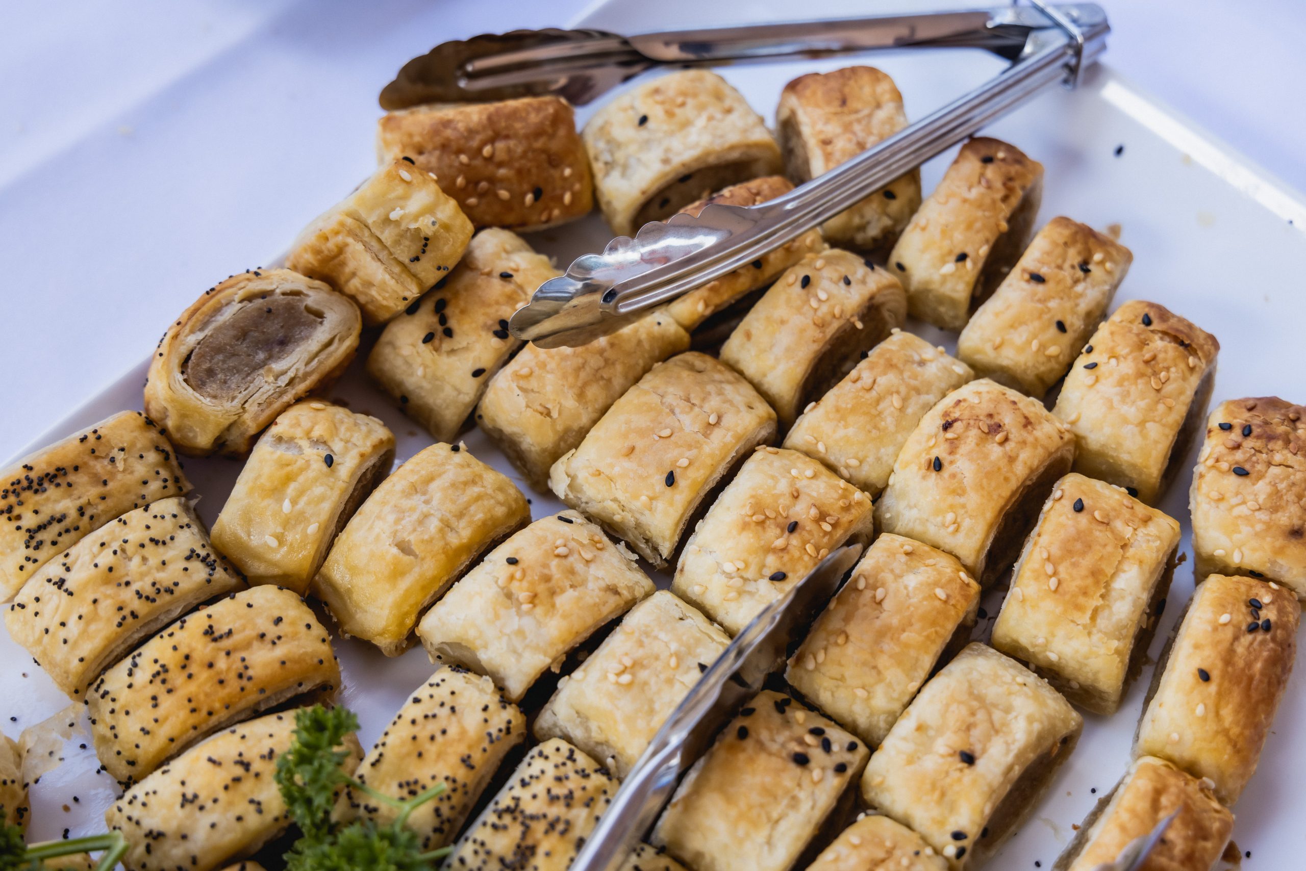 sausage rolls on a platter prepared by Celeste Catering
