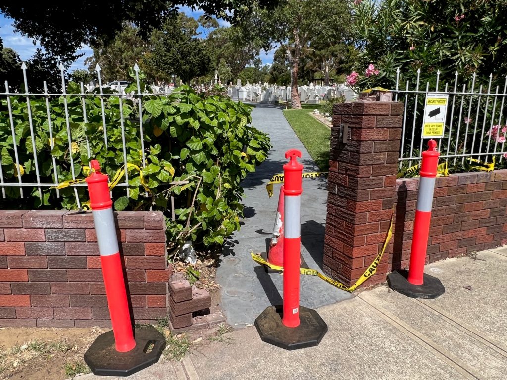 The Bon Scott gate has been removed for repairs at Fremantle Cemetery.