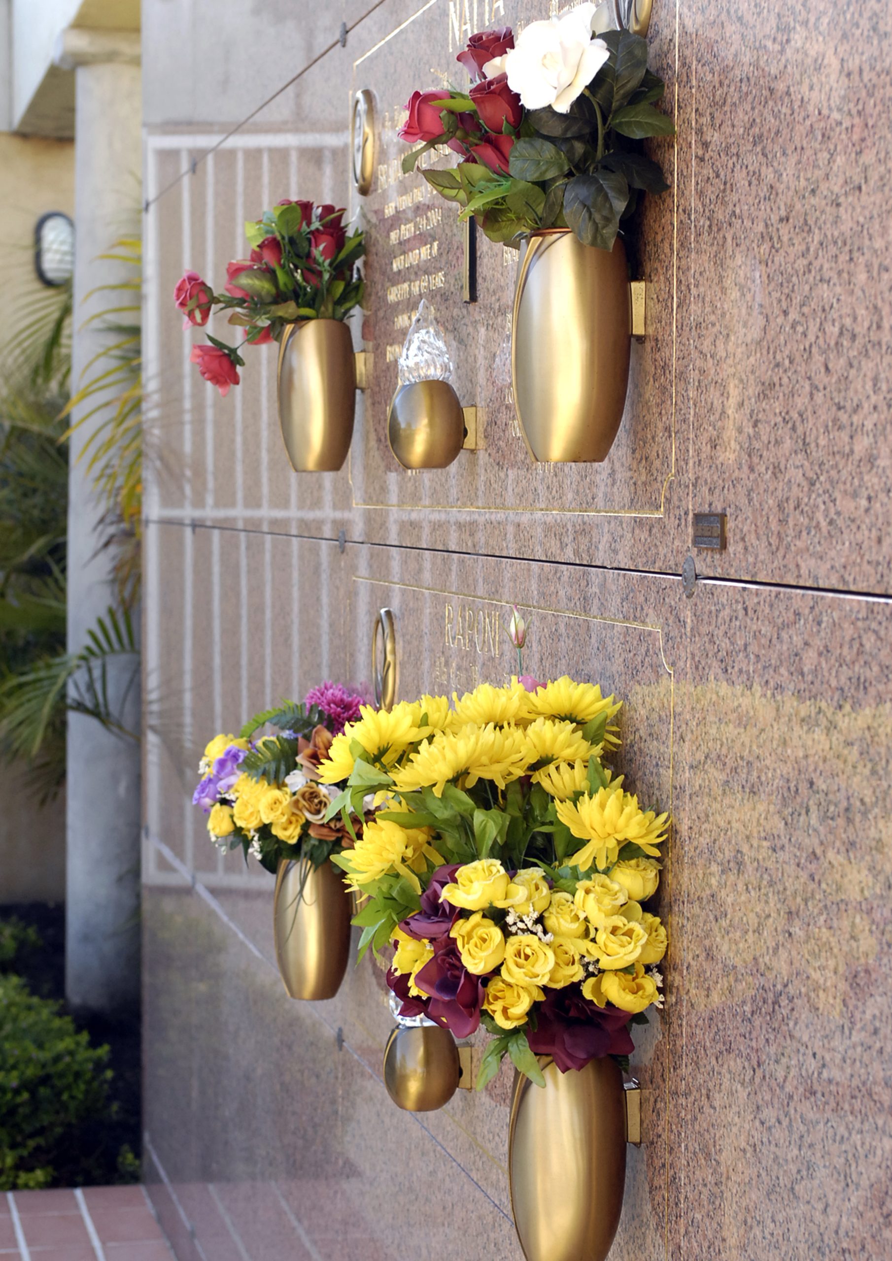 Guildford Cemetery Garden crypts with floral tributes