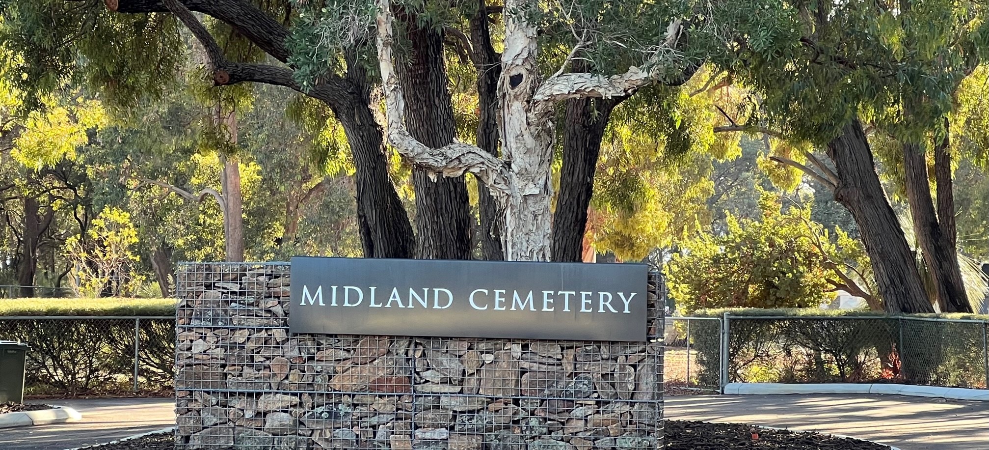 Midland Cemetery new entrance sign in corten steel with gabion wall filled with moss rock